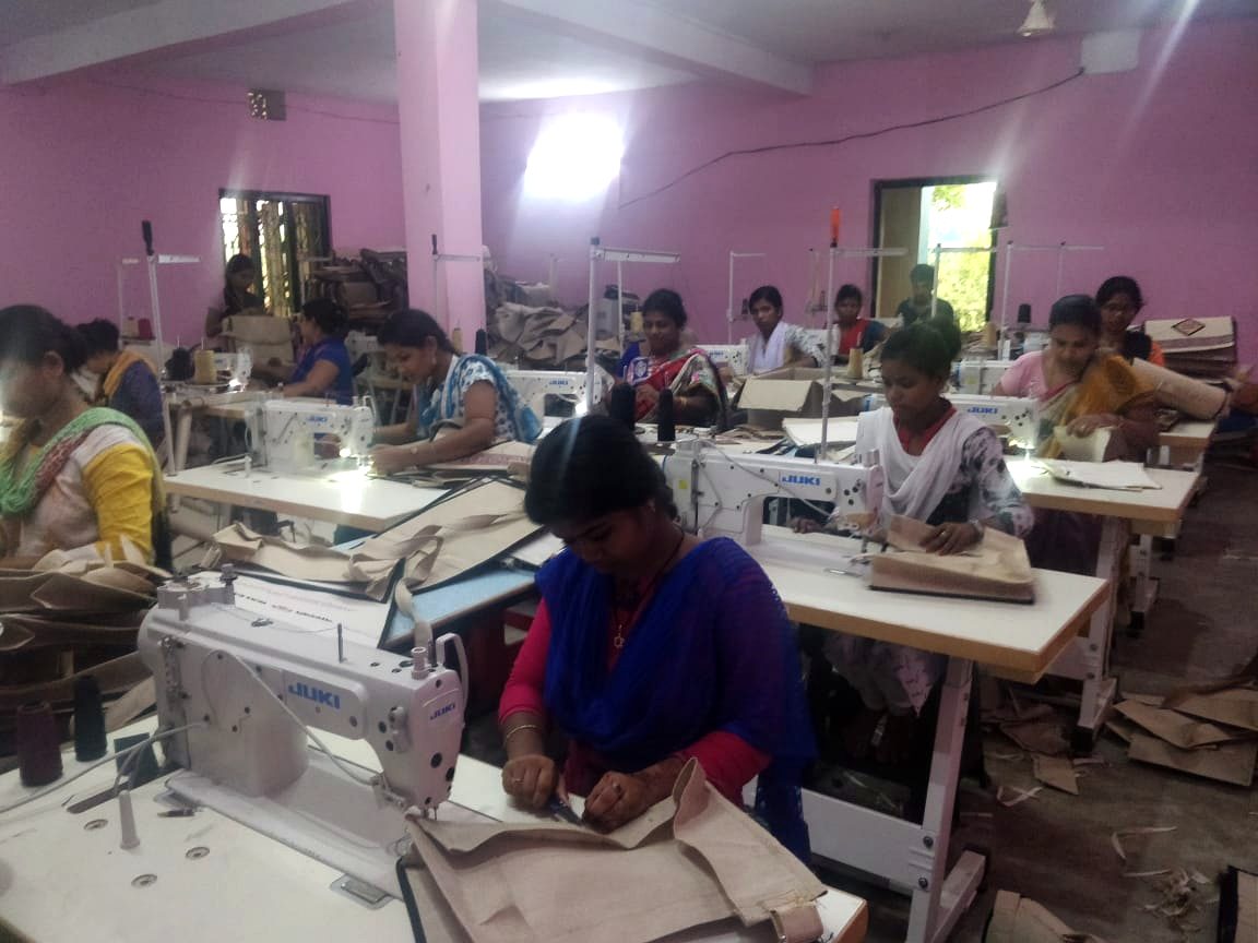 Women operators working at Juki stitching machines on the Haastika factory floor in Pipili